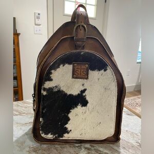 STS Ranchwear Cowhide Backpack upcycled into a sling bag